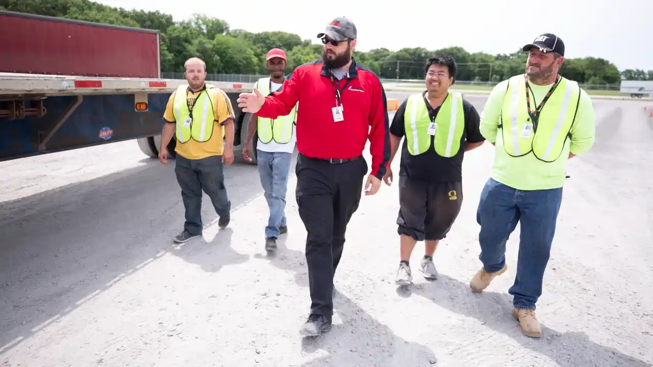 Driver Instructor walking with students