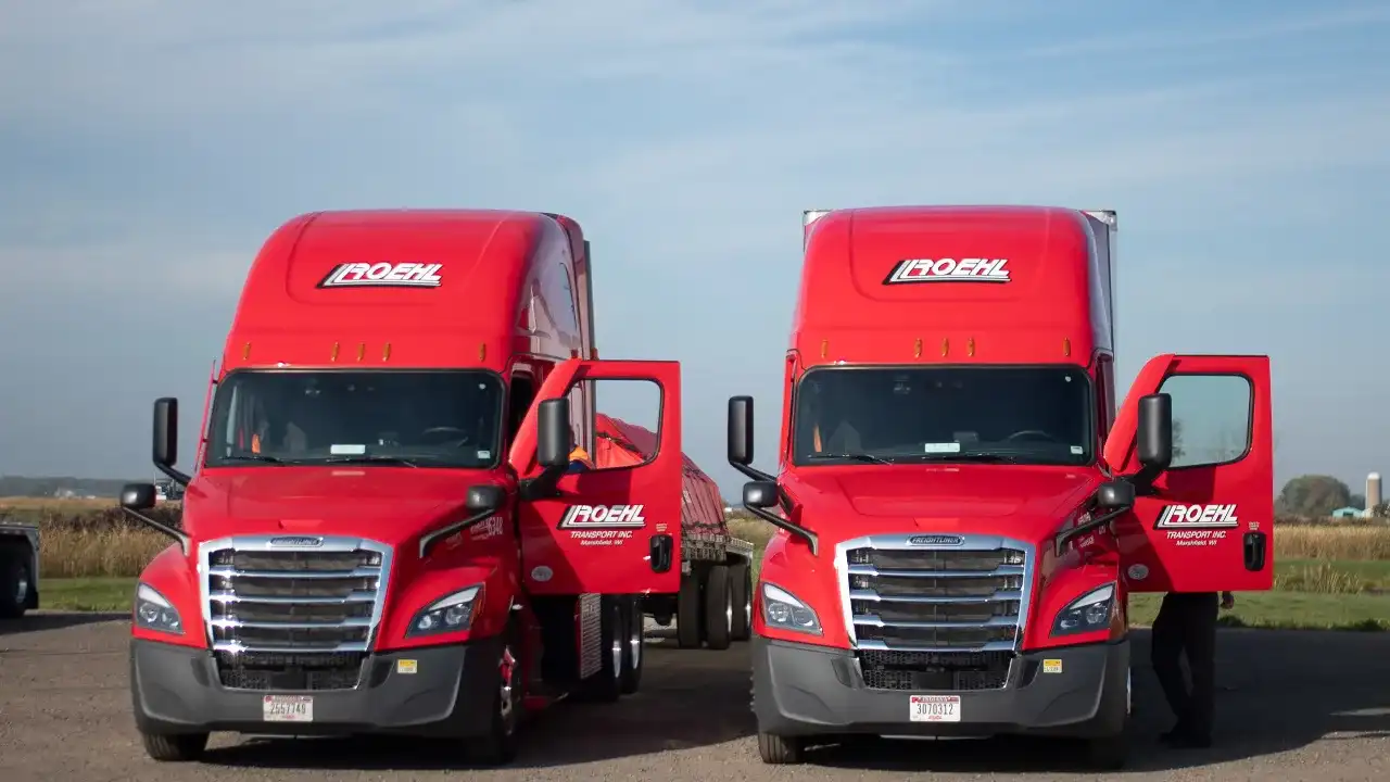 Four Roehl Trucks On a Gray Background