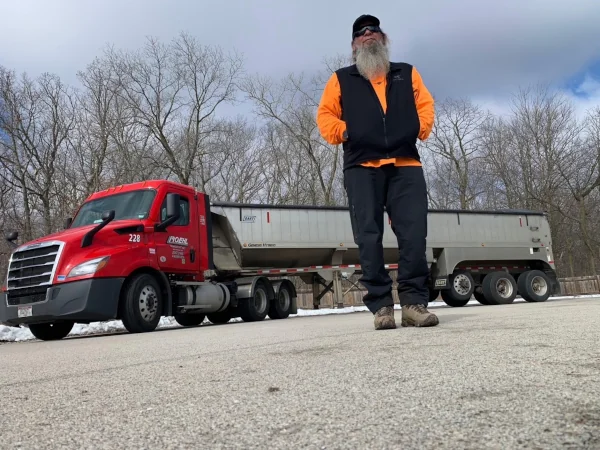 Frank H. with an end dump truck