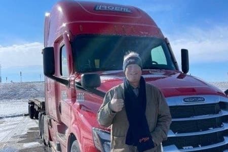 Daniel Walton with his truck. Daniel got his CDL through Roehl Transport.