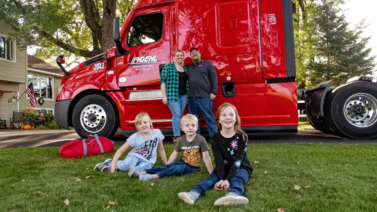 Family at home near Roehl truck