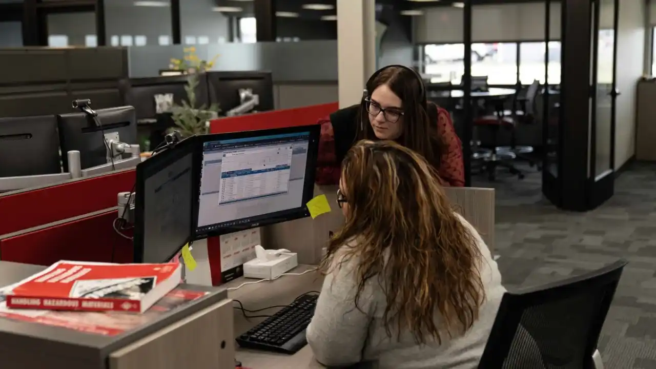 A Roehl Transport Employee at a computer