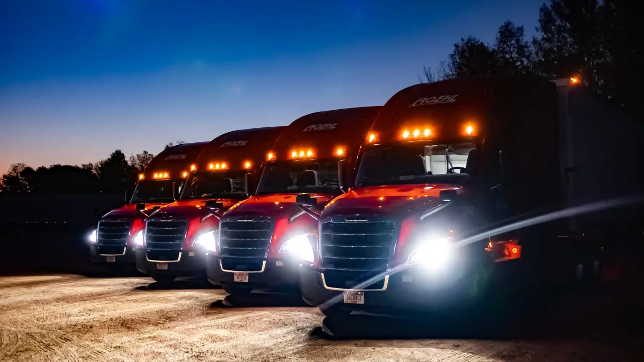 Four Roehl trucks lined up at night