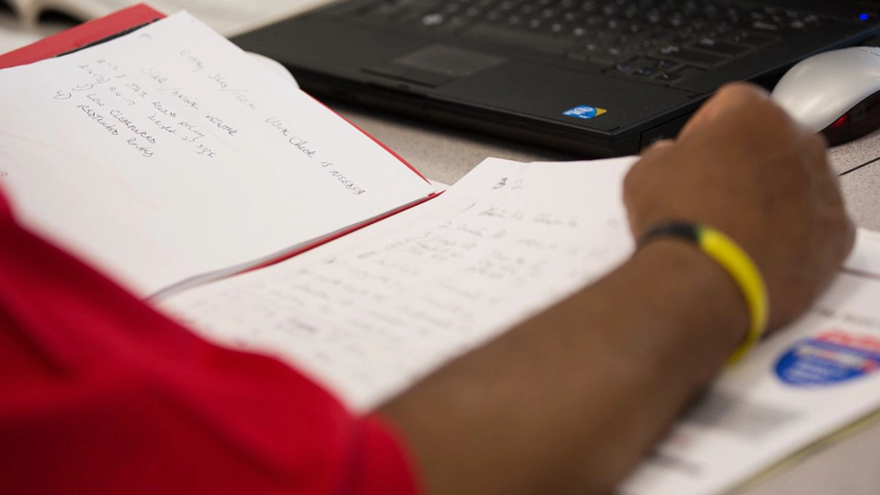 Student looking at test notes