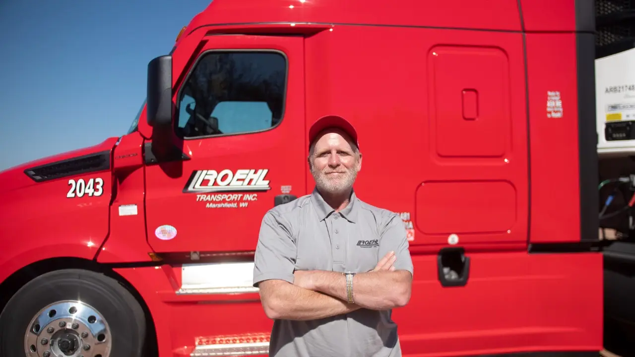 Roehl Driver standing in front of Roehl truck