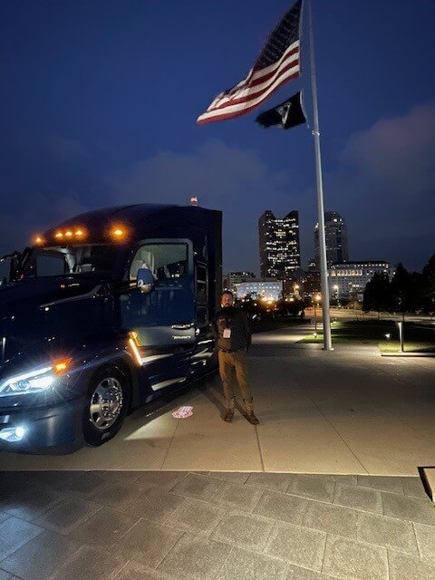 Douglas Couch by Truck & American Flag Douglas Couch by Truck & American Flag